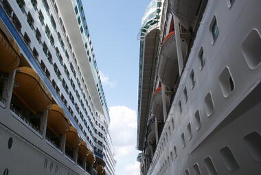 Two cruise ships docked next to each other