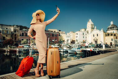smiling woman with suitcases