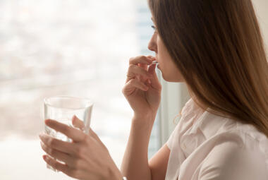 Woman taking a pill